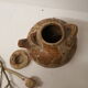 Pot with lid and double sandstone handle