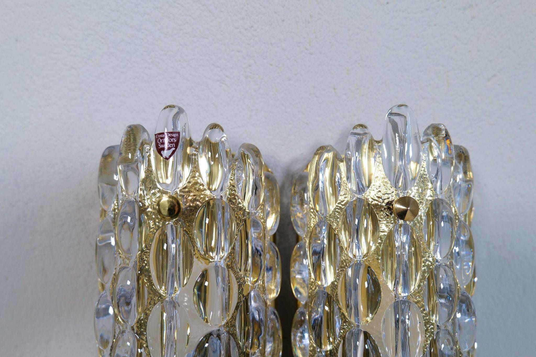 Modern mid-century crystal wall sconces in the shape of a drop by Orrefors by Carl Fagerlund.
