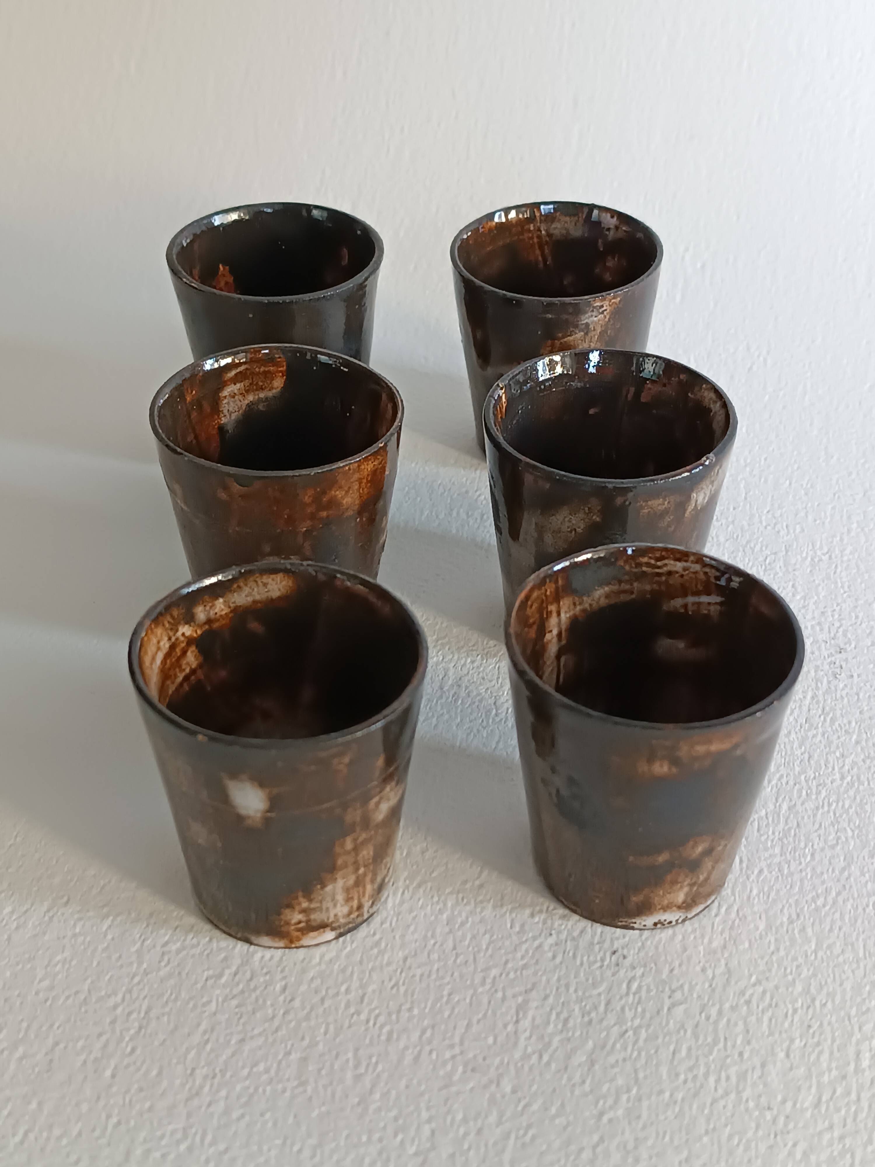 A bottle and six ceramic cups by Gérard Hofmann Vallauris 1950.