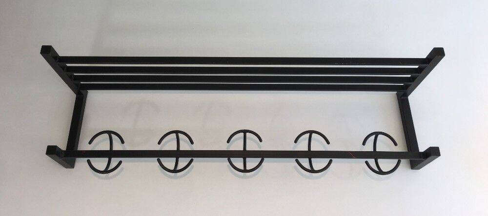 Designer coat rack in blackened metal