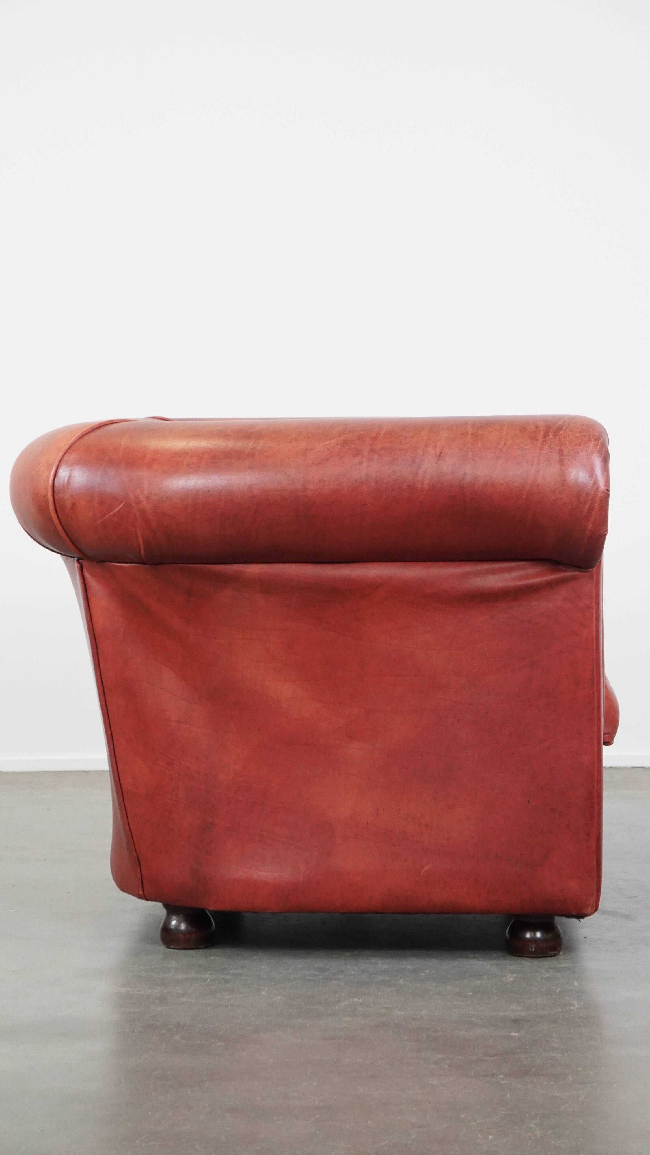 English Chesterfield club chair in light red cowhide leather