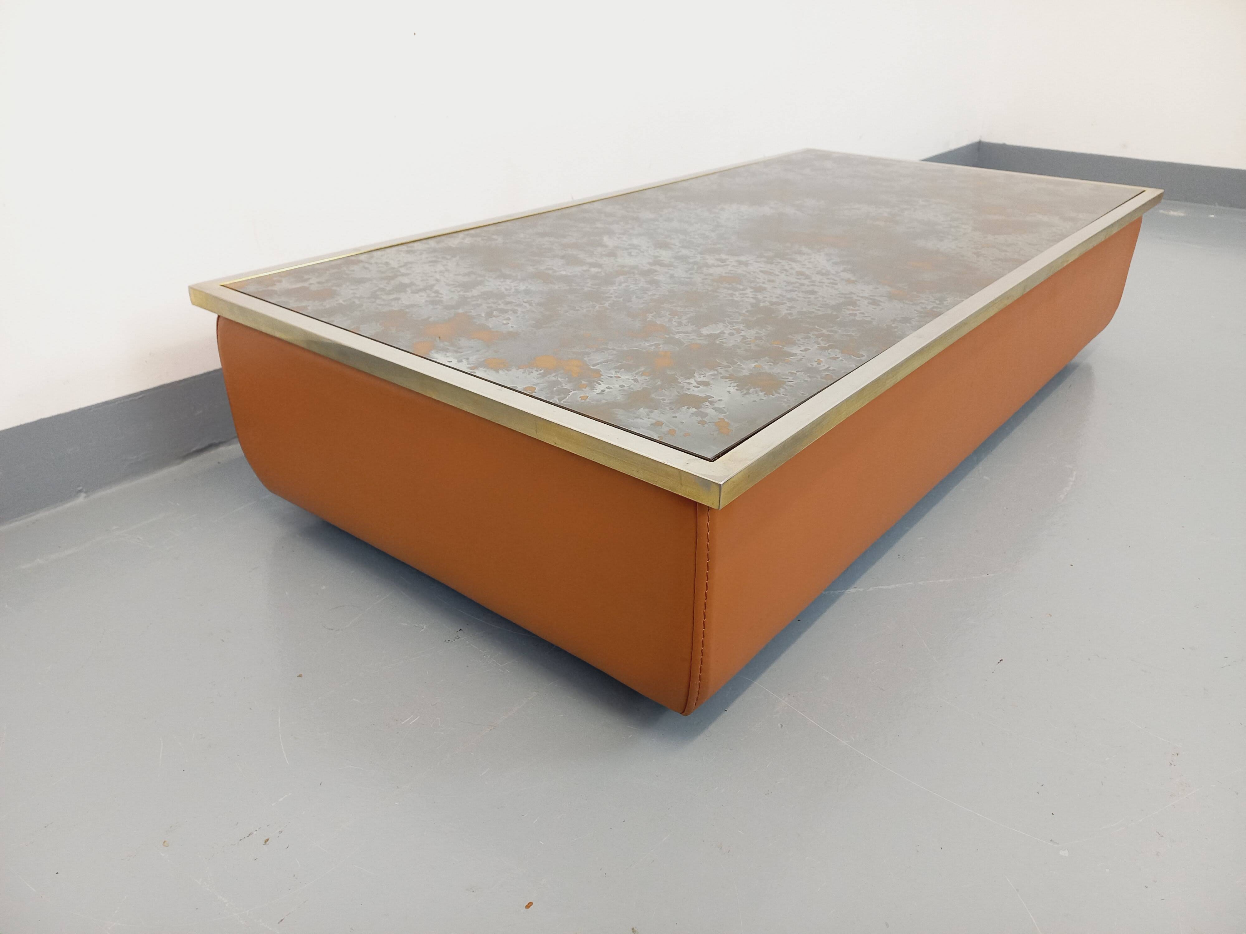 Vintage coffee table in églomisé glass, chrome and leather from the 70s