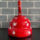Red enameled sheet metal kettle with white polka dots