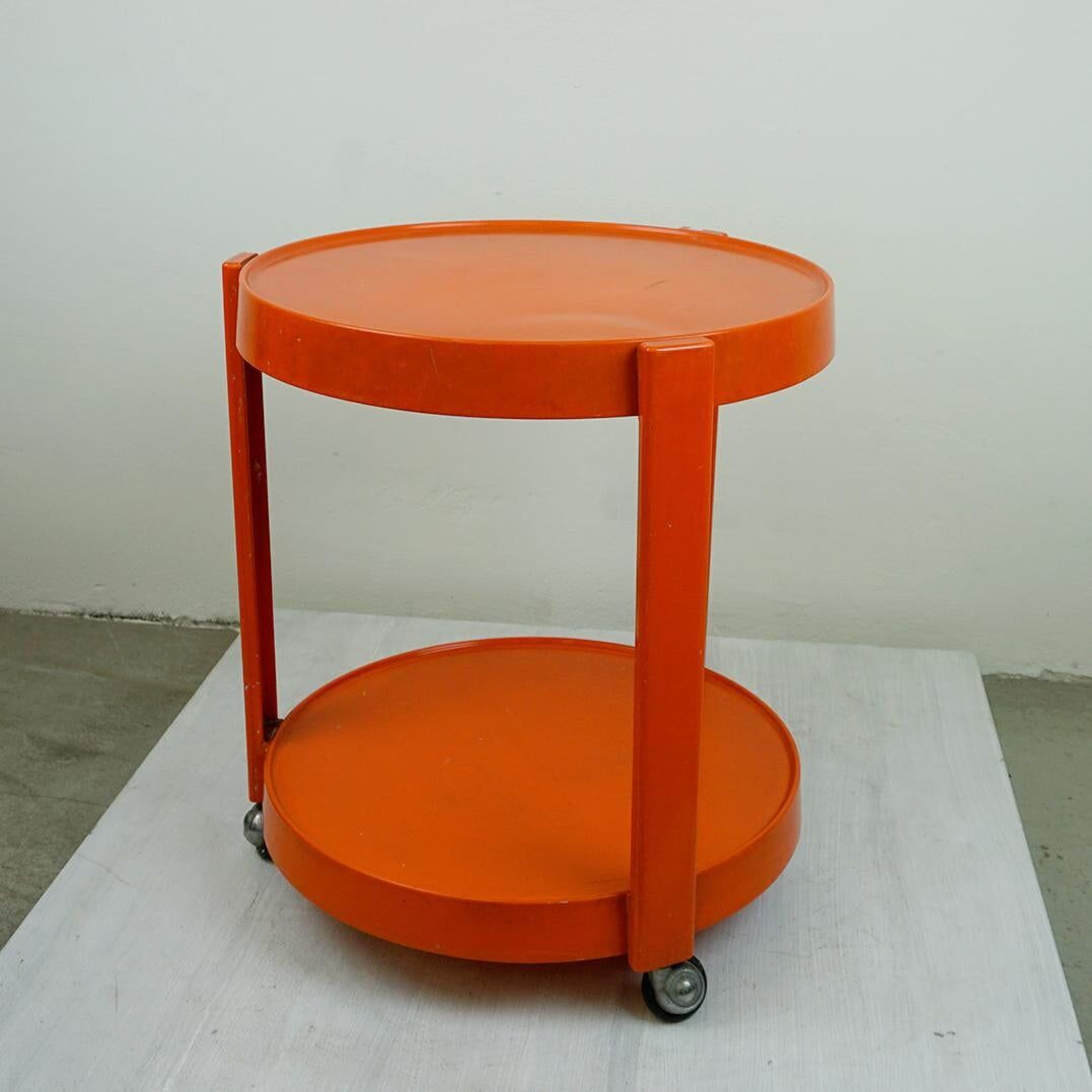 Circular orange Italian Space Age plastic trolley