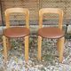 Pair of chairs by Swiss designer Bruno Rey in wood and brown skai