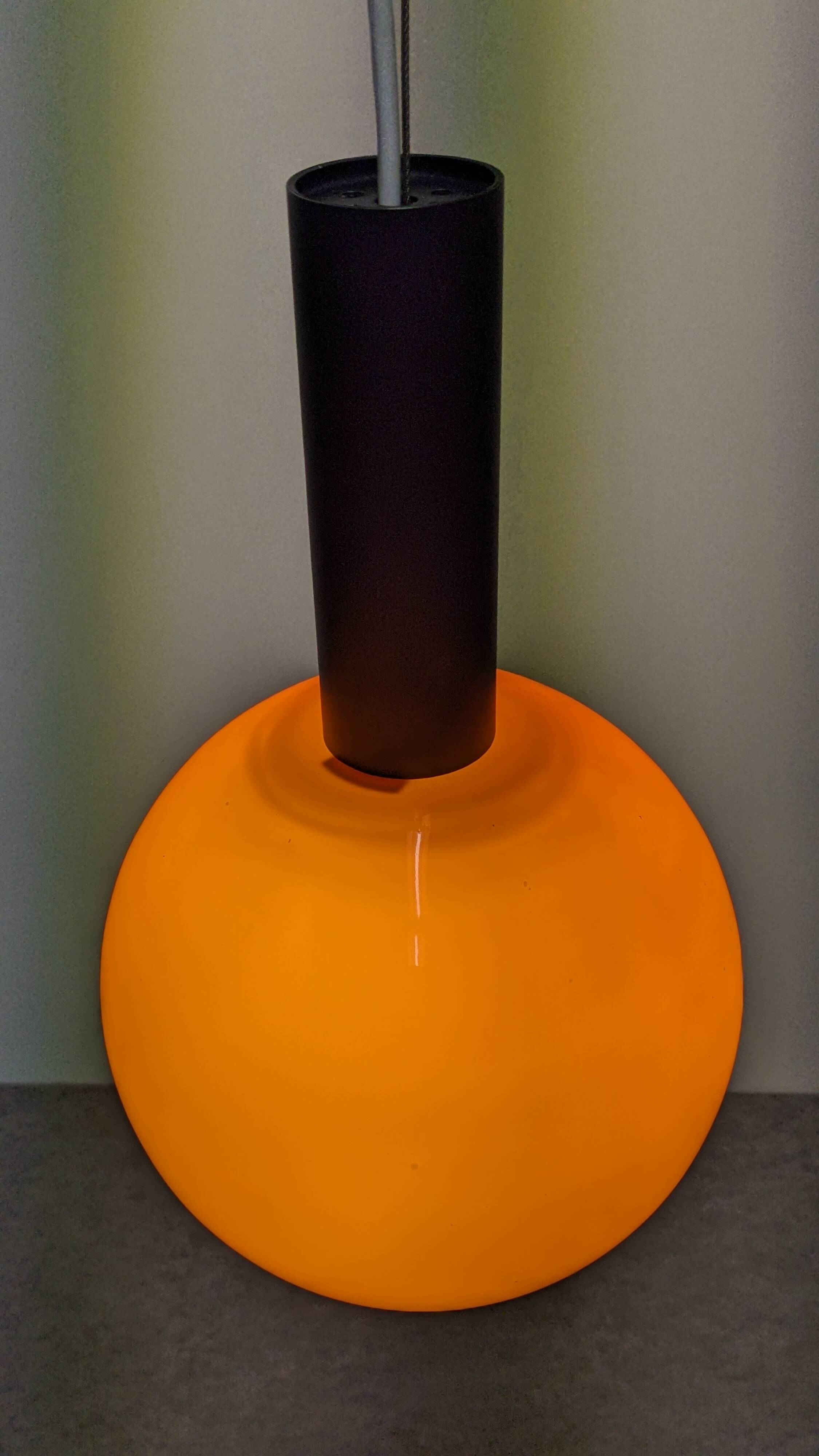 Pair of orange opaline ball pendants by Parscot, France circa 1970.