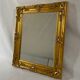 Miroir biseauté style empire doré 64x54cm