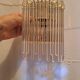 Pair of wall lights with hanging glass pendants in gold color