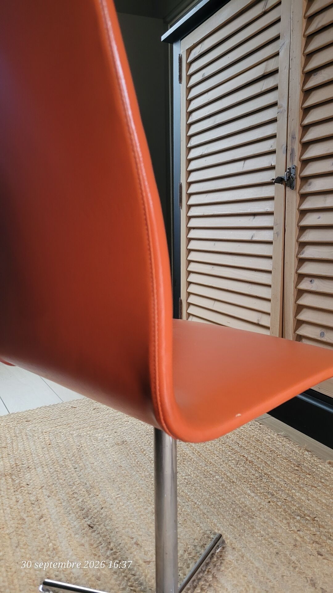 2 orange faux leather swivel chairs