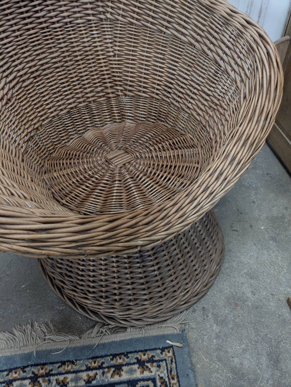 Large woven rattan armchair