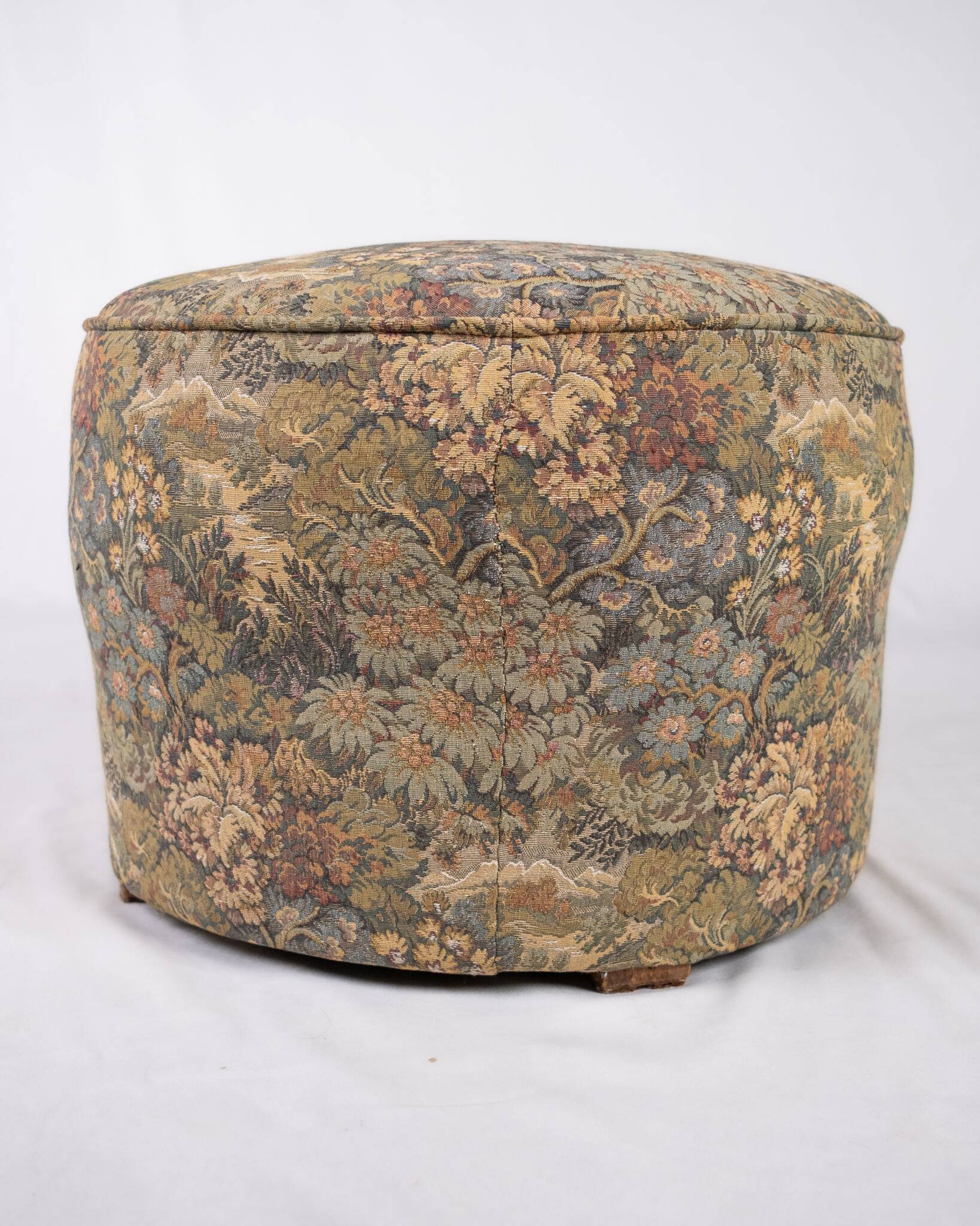 Upholstered pouf in verdure tapestry style, France, late 19th century.