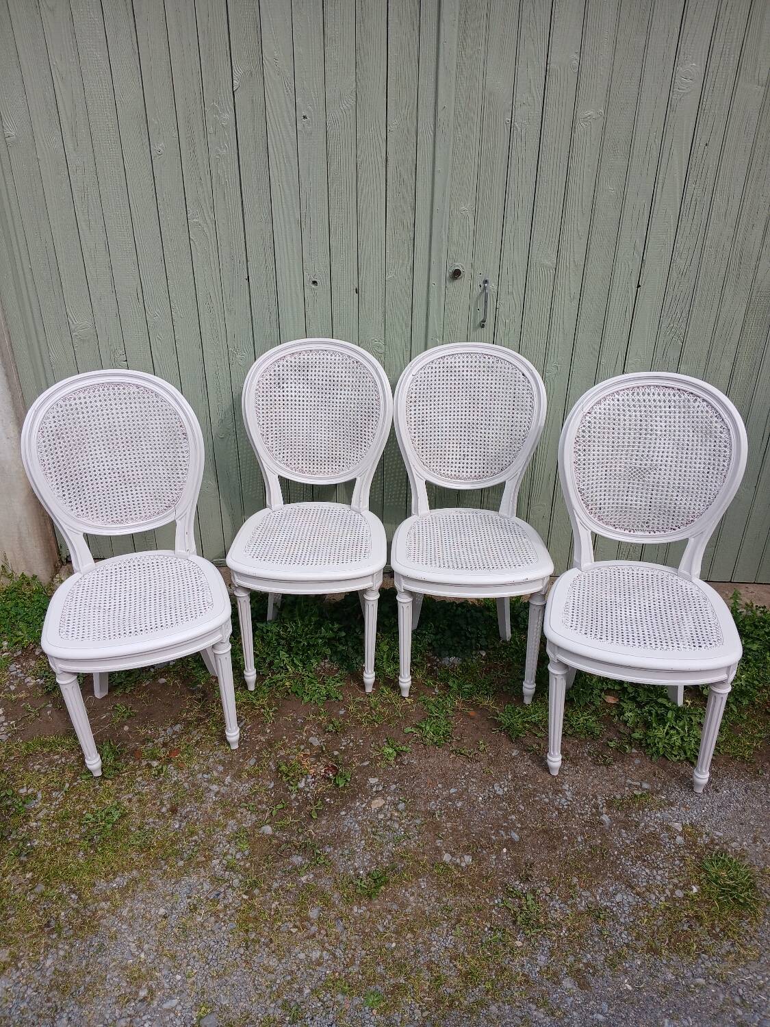 4 old wooden and cane chairs
