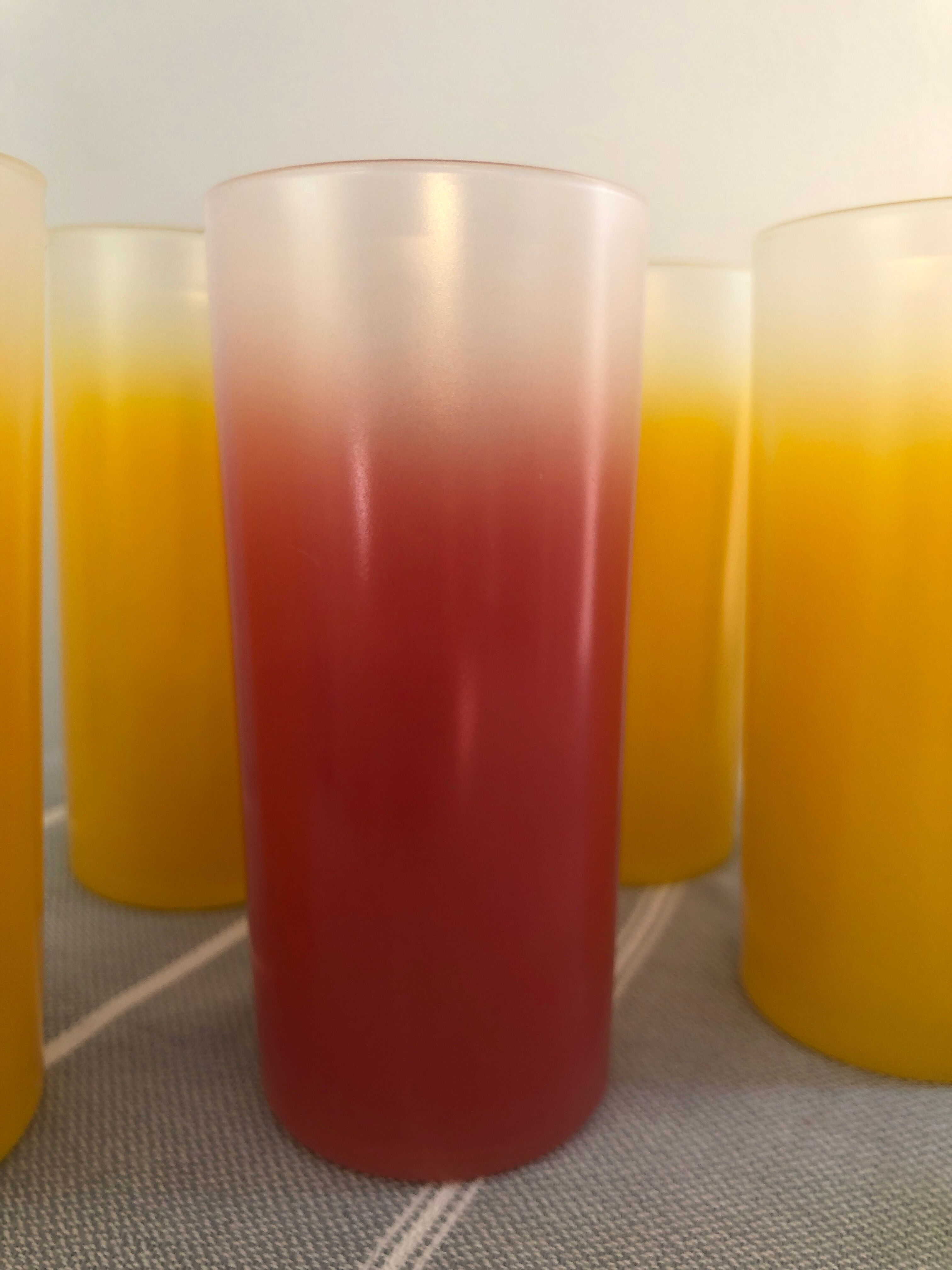 Yellow, red and frosted yellow orangeade glasses made of vintage glass