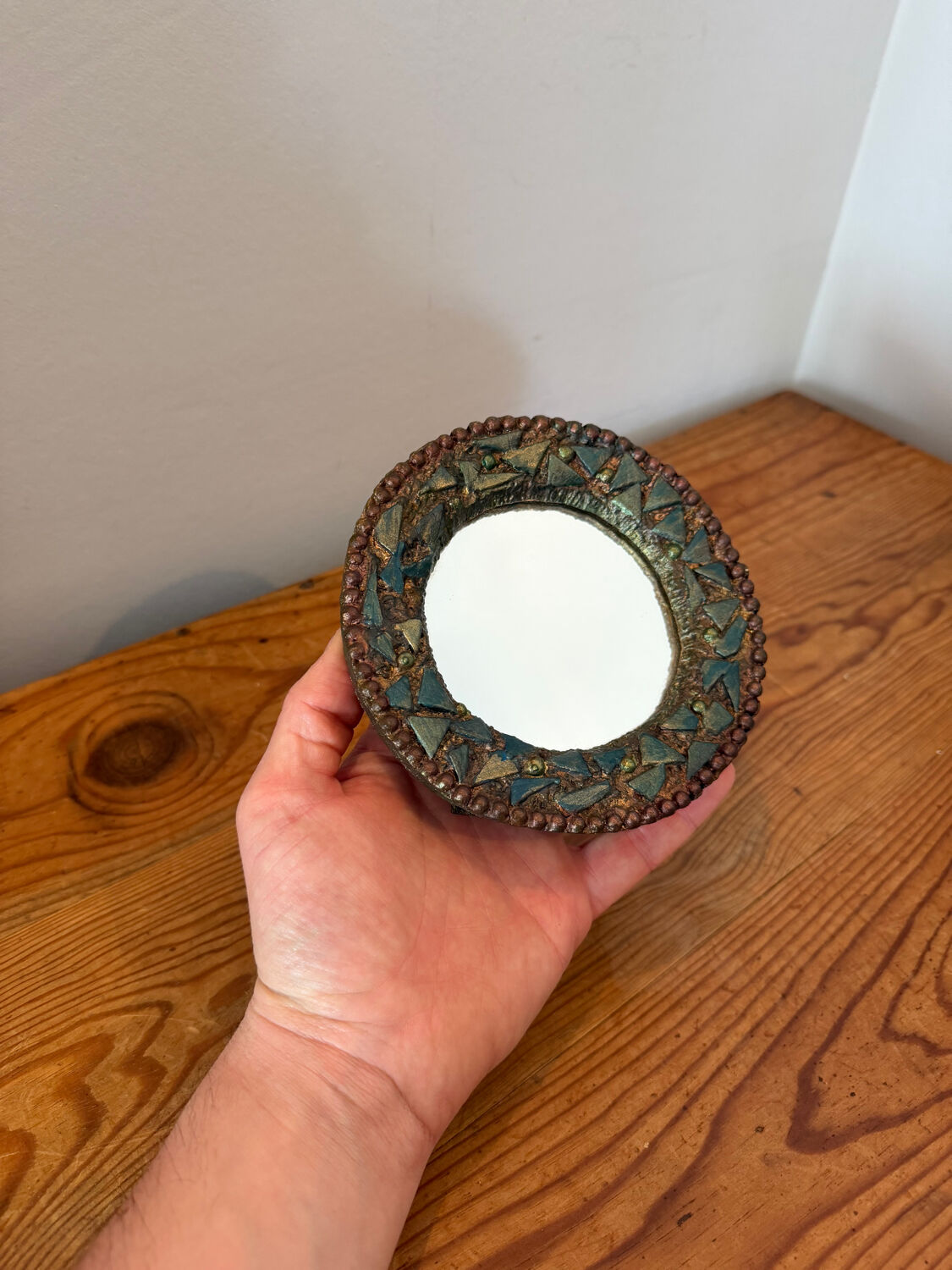 Round mirror in gilded enamelled ceramic with inlay