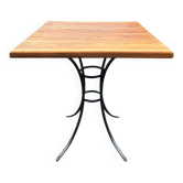 Vintage bistro table in wood and wrought iron.