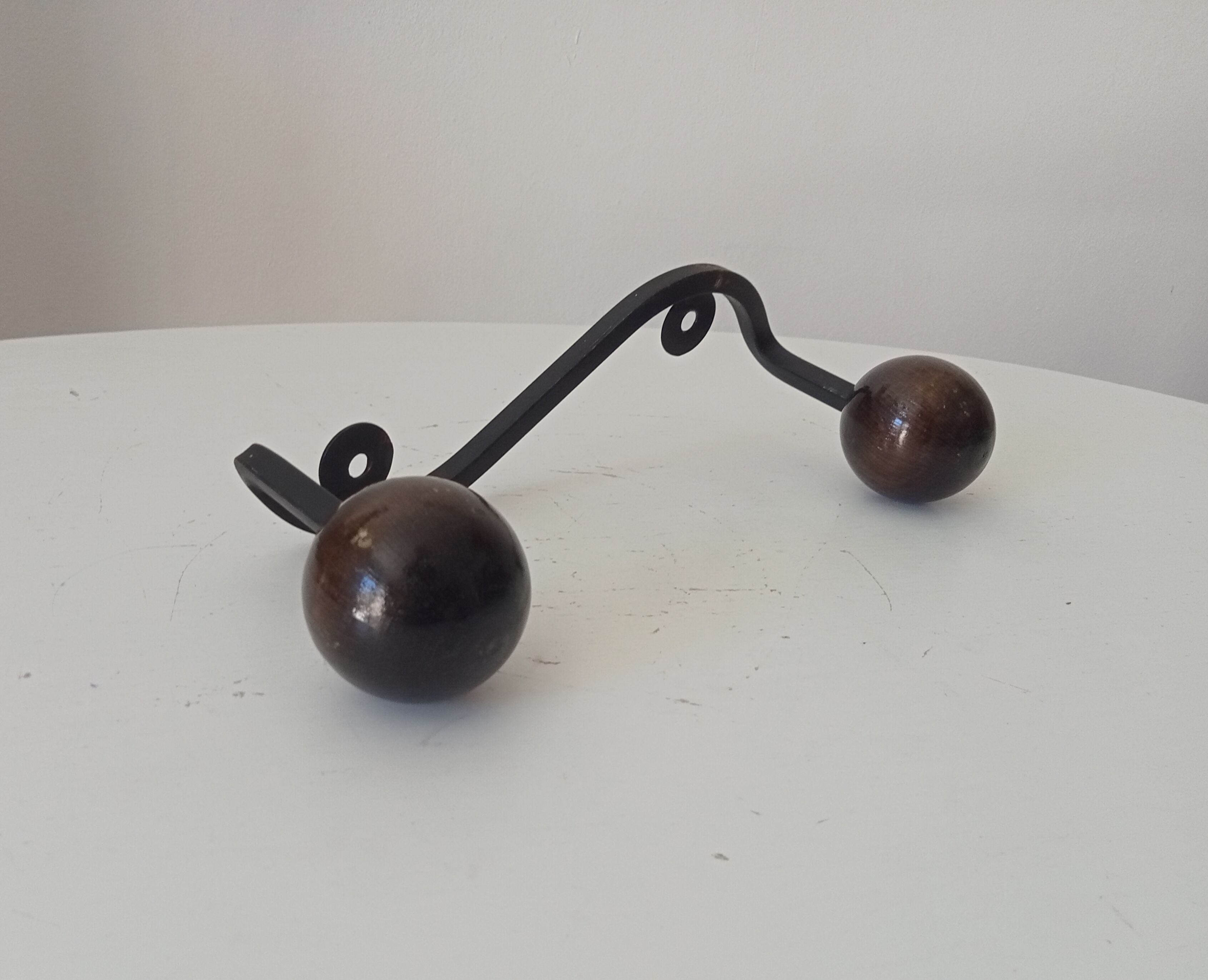 Wood and wrought iron ball coat rack from the 1950s.