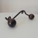 Wood and wrought iron ball coat rack from the 1950s.