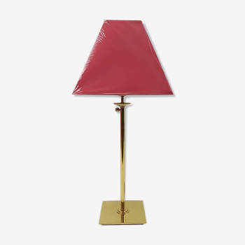 Brass lamp and gold metal with red lampshade with adjustable foot