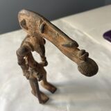 Statuette man with large head