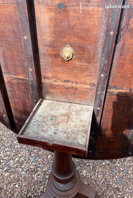 Old and large round winegrower's table made of wood.