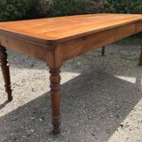 Table de ferme ancienne de style Louis Philippe en cerisier massif avec ses 2 allonges.
