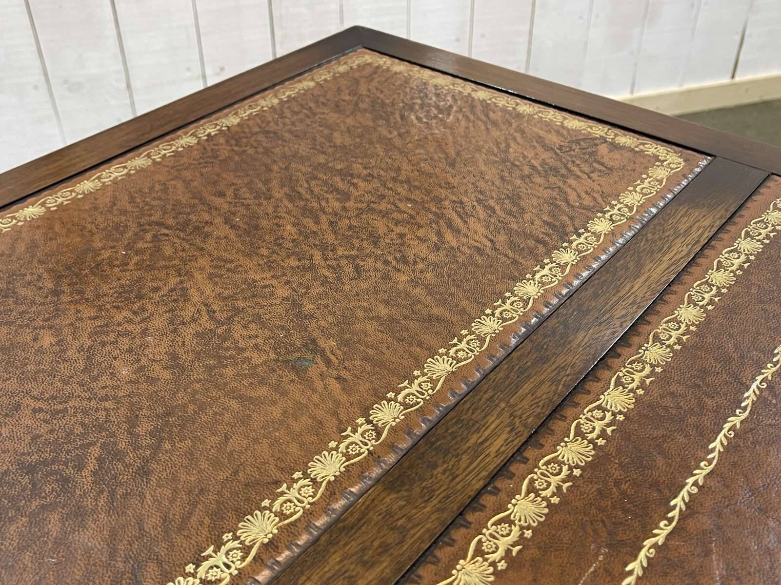 English mahogany pedestal desk with leather top from the 1950s