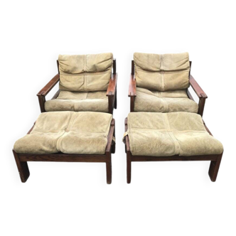 Set of 4 brown leather and wood armchairs with footstools, vintage 1960s style.