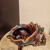 The shell-shaped trinket dish in Vallauris style.