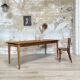 Vintage farm table with spindle legs.