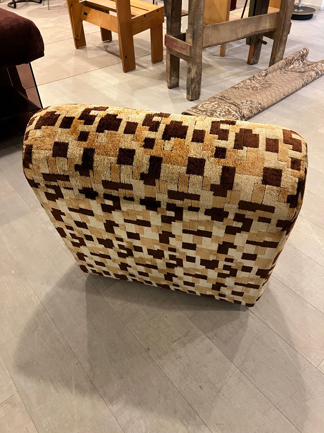 Vintage armchair from the 70s in beige and brown.
