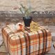 Pair of vintage 70s fabric coffee tables with glass tops