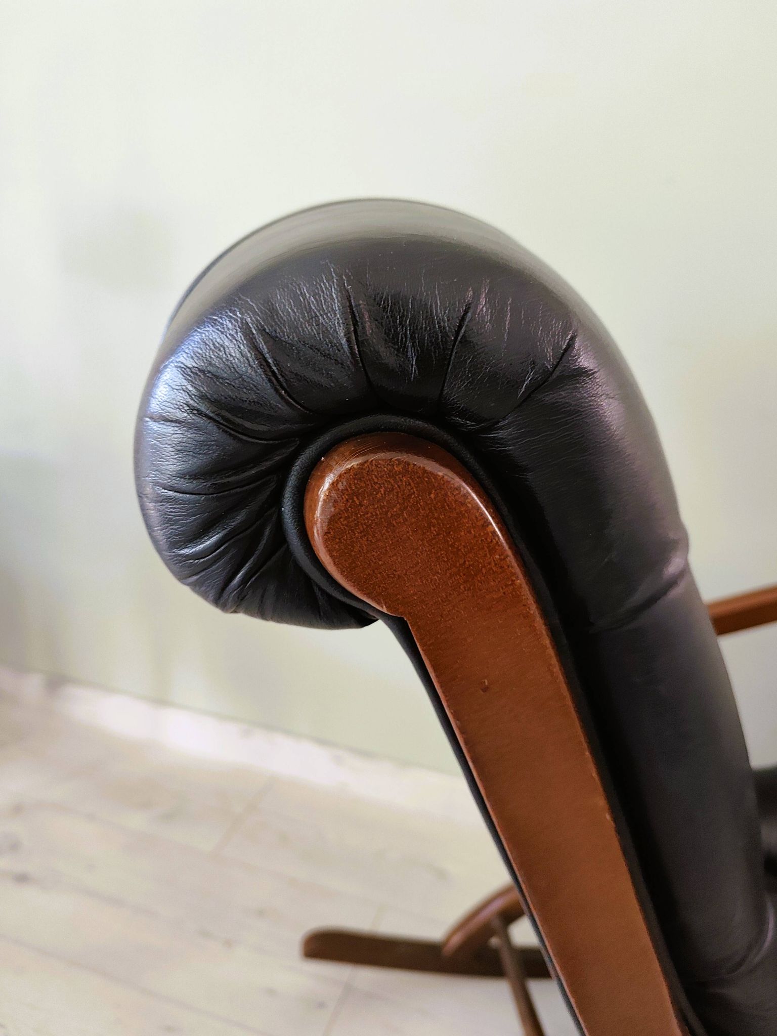 Black leather rocking Chesterfield armchair