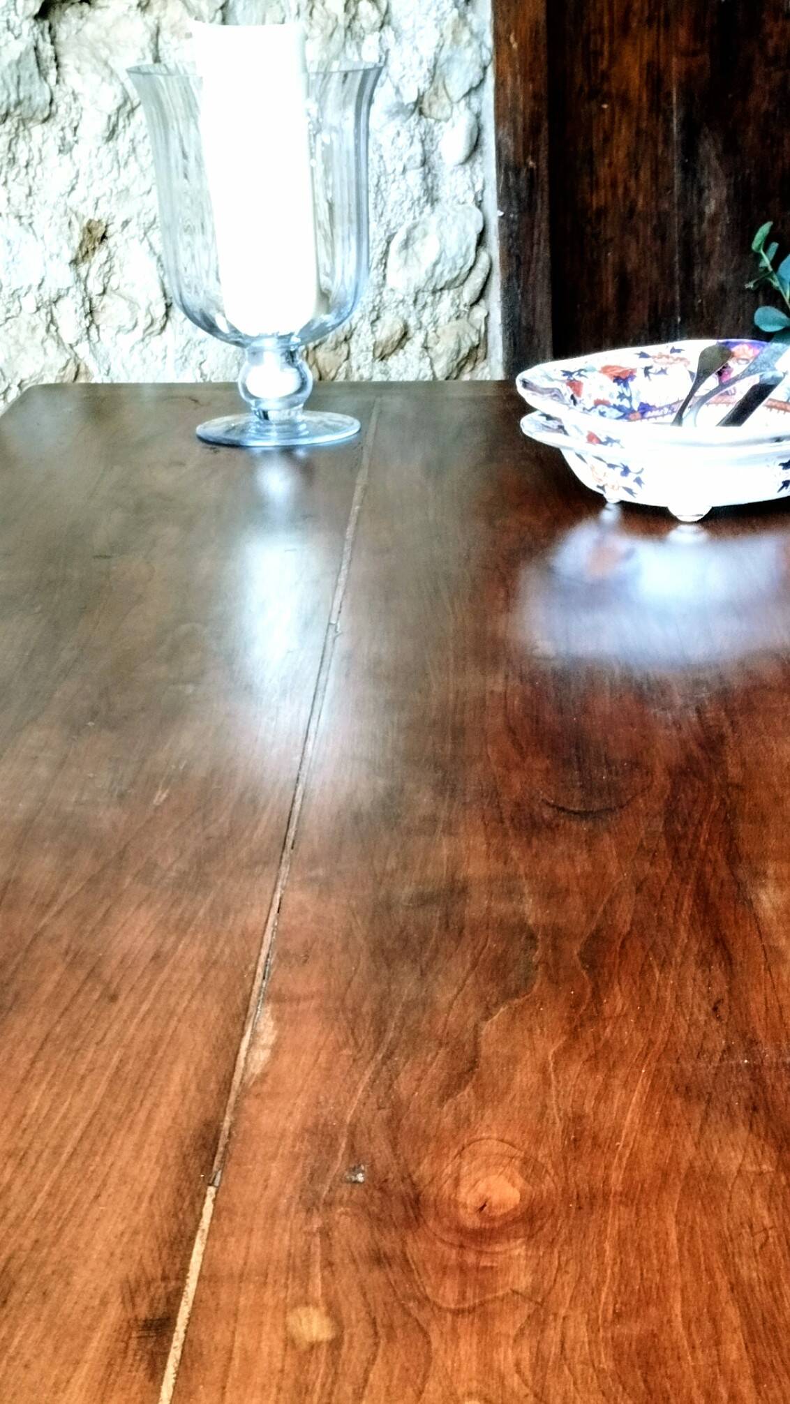 Old French farmhouse table in walnut with turned legs.
