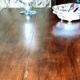 Old French farmhouse table in walnut with turned legs.