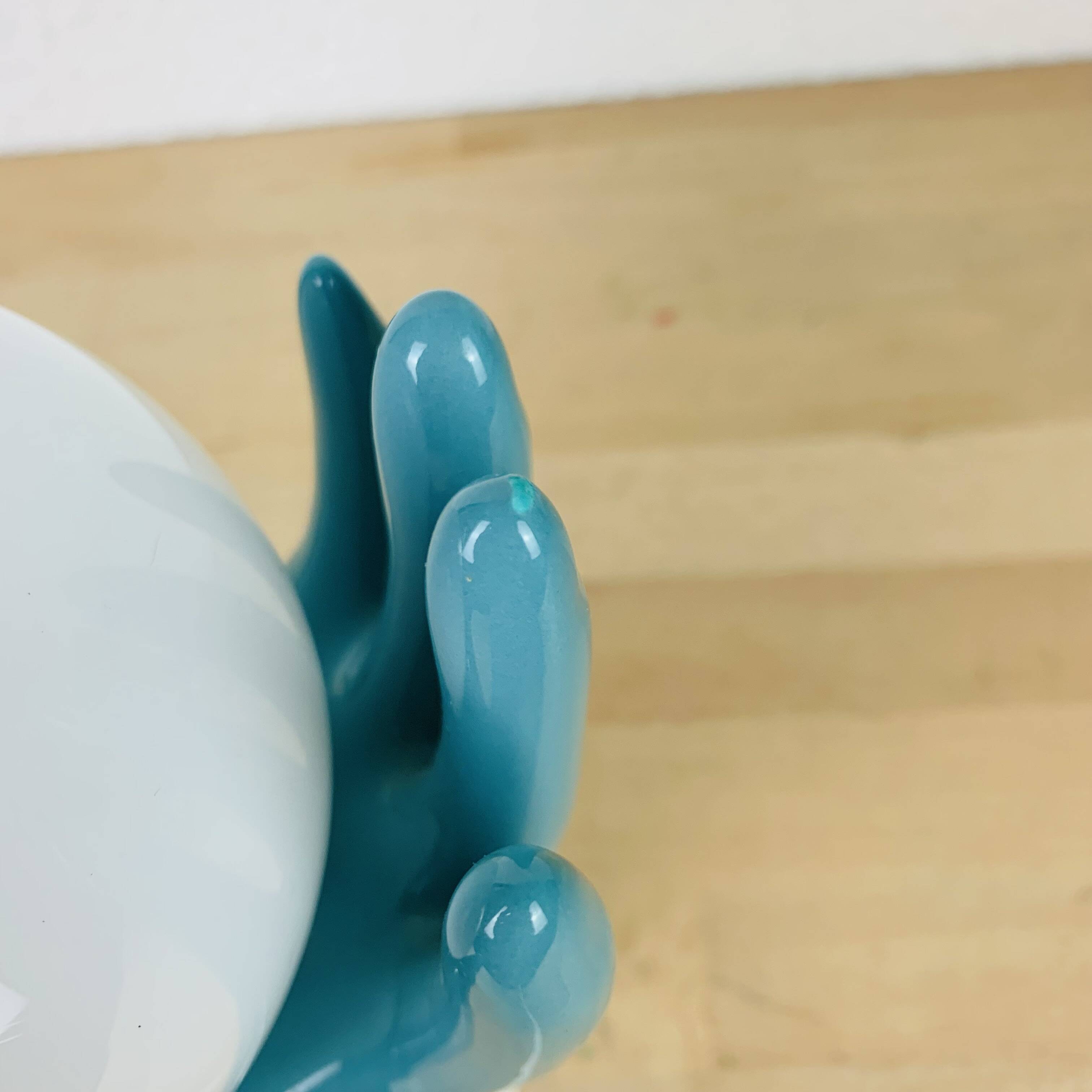 Blue ceramic hands lamp and glass globe