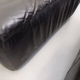 Vintage corner sofa composed of 3 modules in black leather with integrated bed.