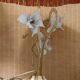 Large gilded brass lamp with white porcelain fleur-de-lis decoration
