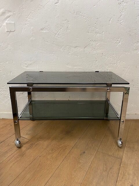 Vintage coffee table on chrome wheel and smoked glass