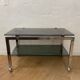 Vintage coffee table on chrome wheel and smoked glass