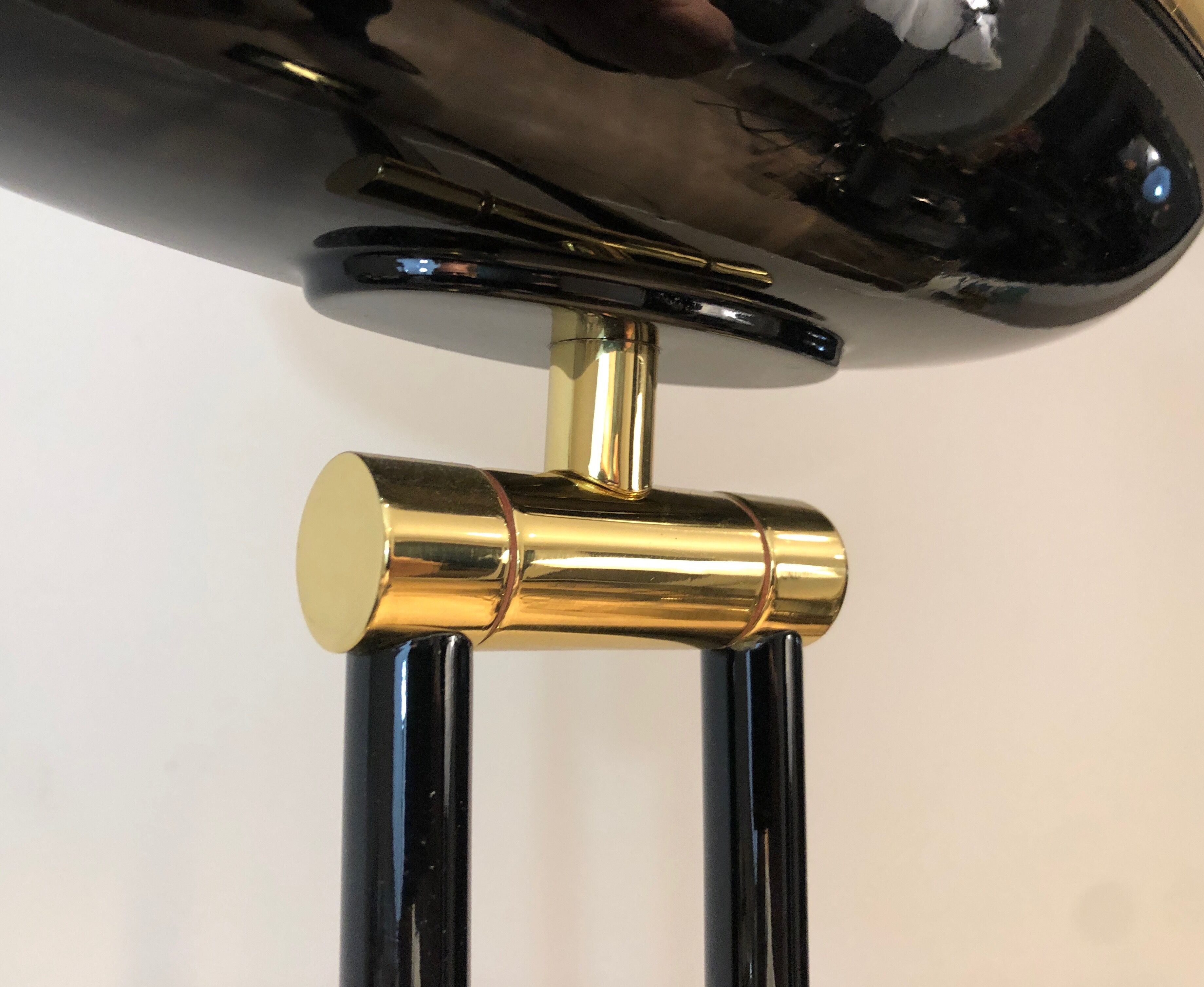 Floor lamp in black lacquered metal and brass