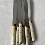 Série de 11 couteaux de table dentelés vintage