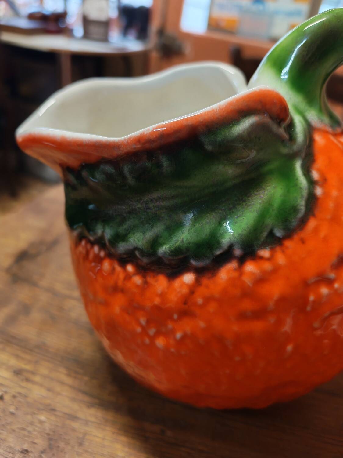 Orange slipware pitcher