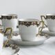 7 Limoges porcelain cups and saucers with gold decoration and floral motif.