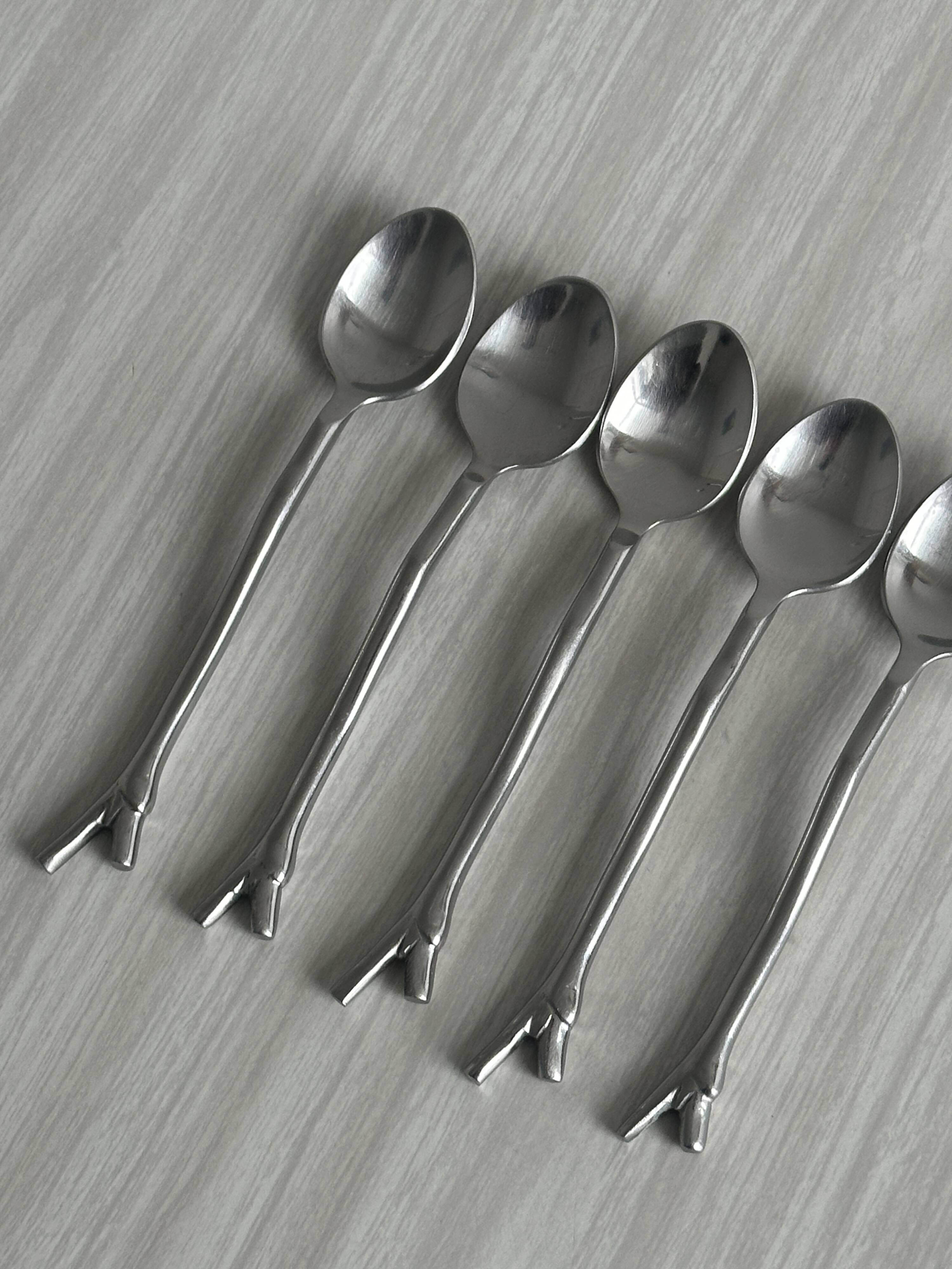 5 small silver metal spoons