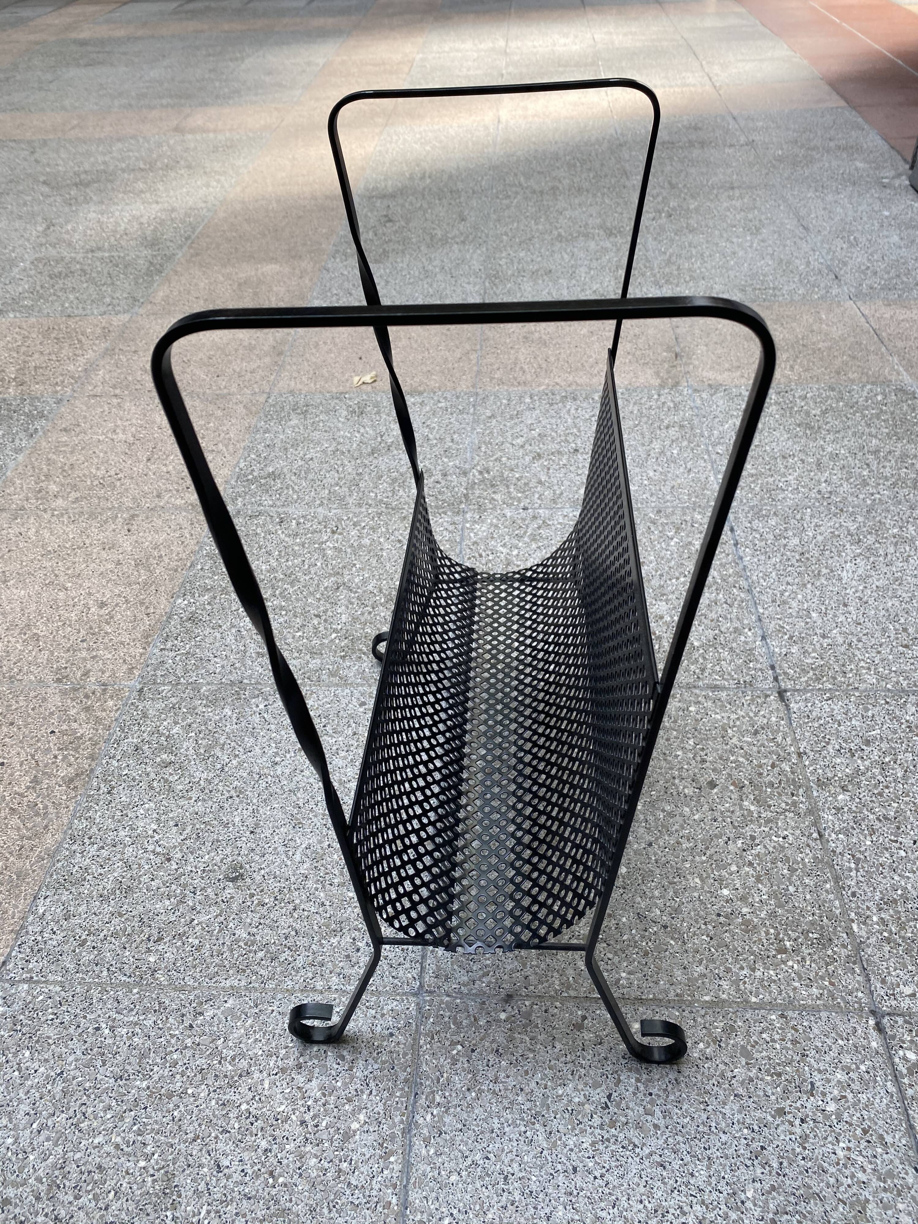 Perforated metal magazine holders - 1975