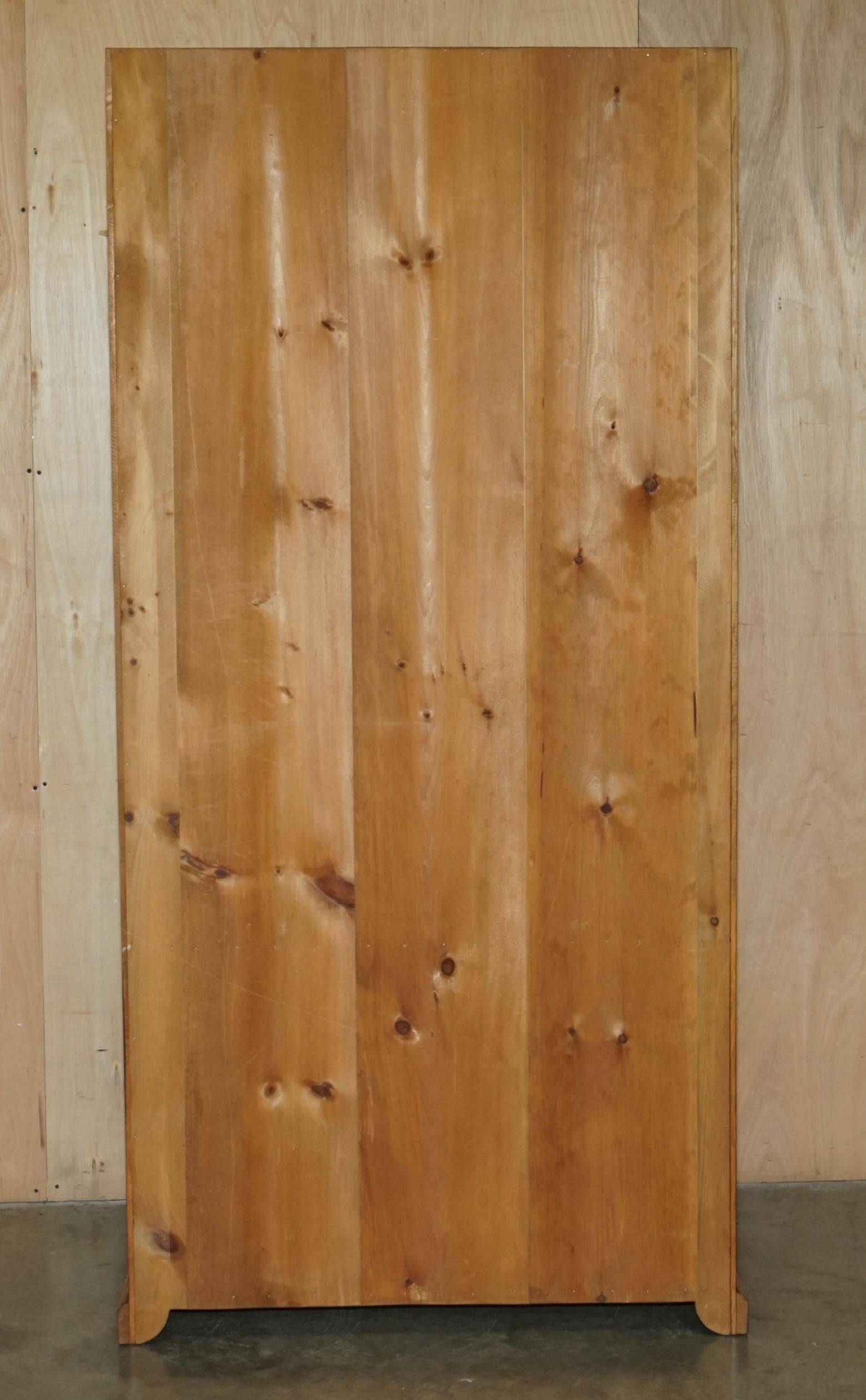Pair of vintage cherry wood bookcases with lockable doors.