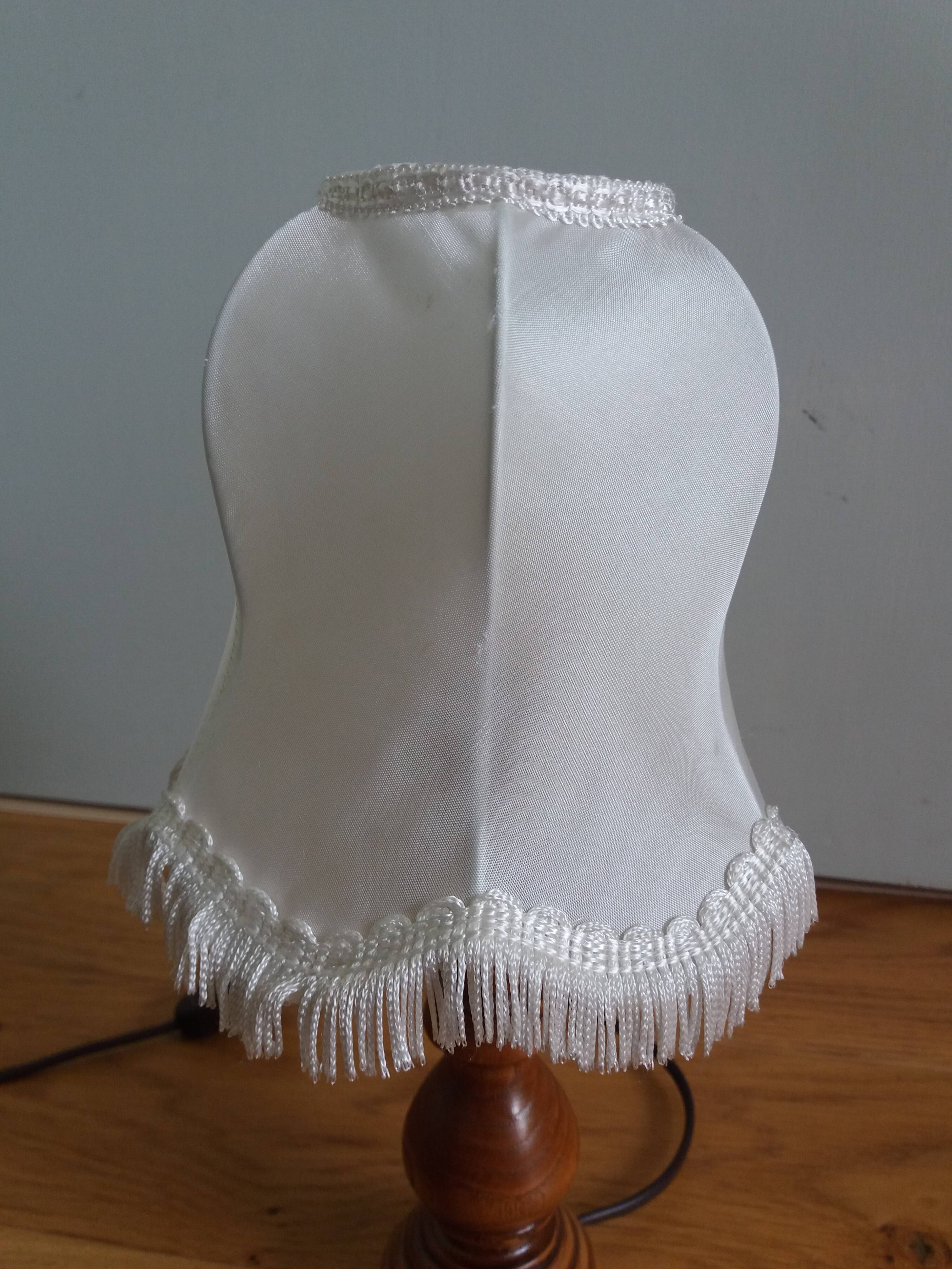 Turned wood lamp with fabric lampshade