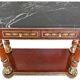 Console topped with an Empire-style mirror.