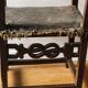 Antique armchair in walnut and studded leather, 17th century