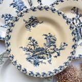 10 mismatched vintage soup plates in blue, green, and red ironstone